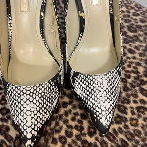 Classy Leopard Design 3 1/2 inch.Lightly used. Small tear inside shoe pressure